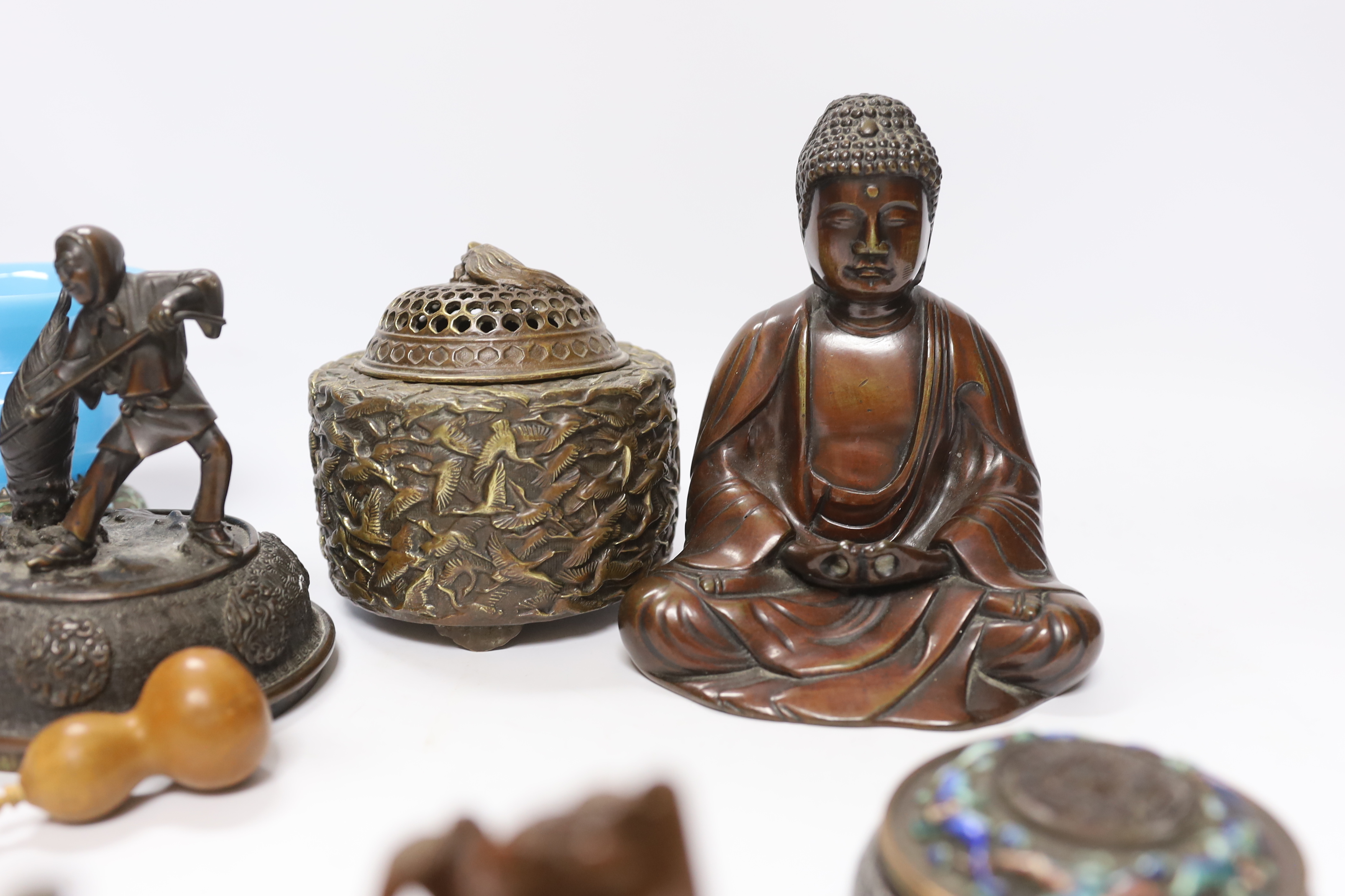 A quantity of Chinese bronzes and wood carvings including stands, seated Buddha etc.